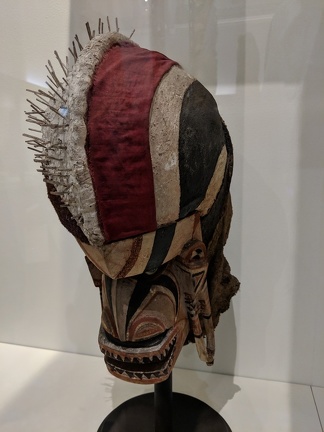 "Mask with black markings over face"